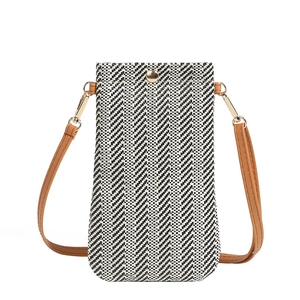Vertical black and white woven straw phone bag with brown leather strap and gold hardware