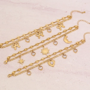 Zweilagiges Armband aus goldenem Titanstahl mit Schleife, Herz und Stern-Anhängern