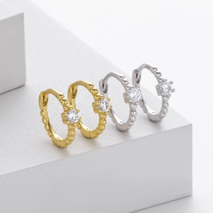 Detailed view of S925 sterling silver hoop earrings with zircon and beaded edges