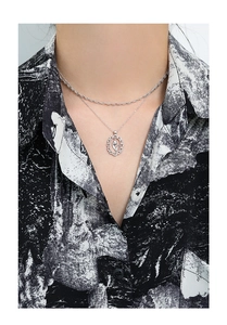Detailed view of S925 silver necklace featuring a hollow oval tulip pendant with crystals