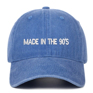 Vintage washed blue cotton baseball cap with white Made in the 90's letter embroidery