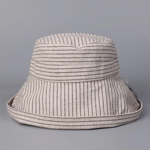 Detail showing the fine black and white stripes and linen texture of the wide brim sun hat
