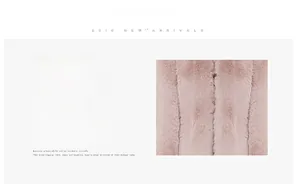 Close-up of soft pink faux fur texture on elegant round neck short coat for women