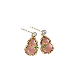Pink gourd pearl drop earrings in gold-tone bamboo style with silver needle studs