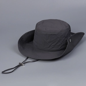 Detail of dark grey sun hat featuring breathable vents and adjustable wind cord
