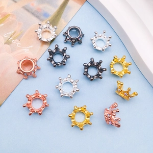 Detailed macro view of colorful crown-shaped spacer beads for DIY jewelry making