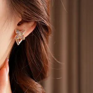 Exquisite four-leaf clover flower earrings with gold edges and sparkling zircon stones