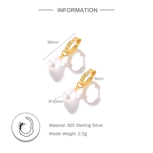 Detail view of gold S925 sterling silver hoop earrings with zircon and drop pearls