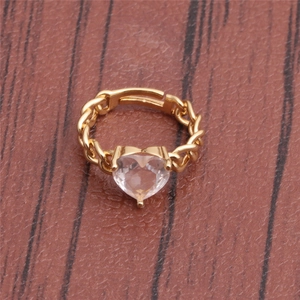 Detailed macro view of heart-shaped crystal on adjustable gold-tone chain ring