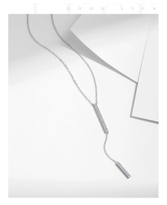 Detail of s925 silver Y-shaped necklace with dual bar pendants and micro-set cubic zirconia