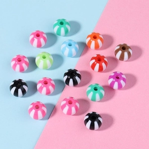 Close-up of colorful striped acrylic candy beads for DIY jewelry and bracelet making