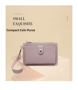Detail view of lychee-textured leather coin purse with wristlet in lavender purple finish