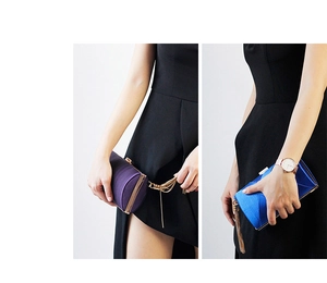 Detail of silk satin evening clutch bags in purple and blue with elegant metal tassels