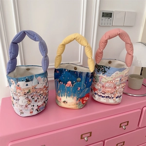 Three colorful canvas tote bags with padded handles and fairy tale illustration details