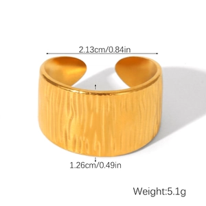 Detail showing 1.26cm width and textured bark pattern on golden stainless steel ring