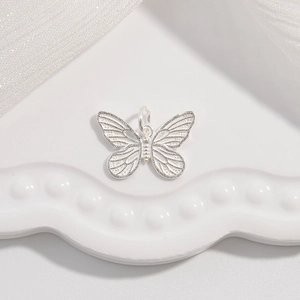 Elegant silver butterfly pendant with hanging loop for DIY jewelry making and crafts