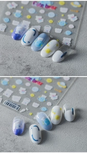 Macro shot of space bear nail art stickers with cute astronaut bears and planet patterns