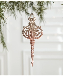 Detailed view of rose gold glittered steeple ornament hanging on a Christmas tree branch