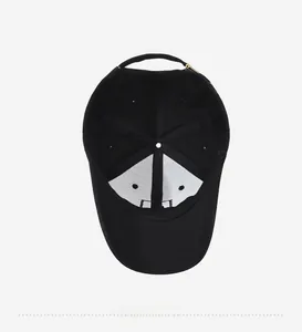 Detail view of the black baseball cap interior construction with white front support lining