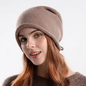 Brown knit slouchy beanie for women with soft texture and minimalist thermal design