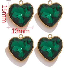 Detailed view of heart-shaped dark green faceted crystal pendants with gold frame 13x15mm