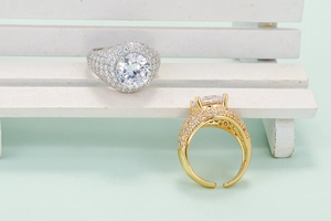 Detailed view of luxury hip-hop rings with large zircons and adjustable gold crown bands