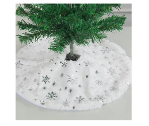 Detail view of white plush Christmas tree skirt with shiny silver snowflake patterns