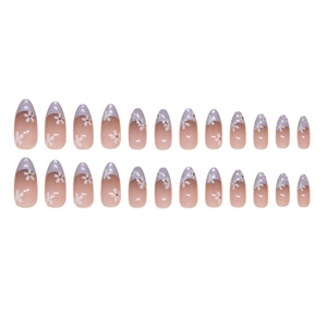 Short almond press-on nails with pink gradient, white french tips and small flower designs