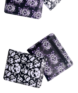 Close-up of bifold wallets featuring spider skull prints and a black zipper coin pocket