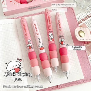 Detail of cute pink retractable gel pens featuring soft spherical sponge grips and cartoon dog motifs