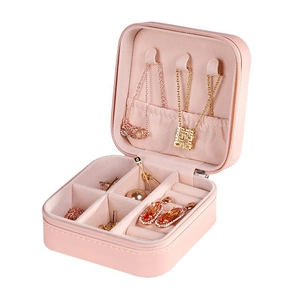 Pink portable jewelry organizer box with zipper and multi-compartment interior