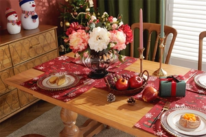 Festive red Christmas placemats and table runner set with white snowflake patterns