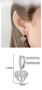 Detailed view showing dimensions and model display of heart-shaped silver hoop earrings