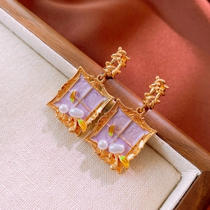 Detail of vintage square enamel earrings with purple marble pattern and pearls
