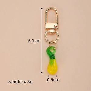 Detailed view of handmade gradient glass pendant with dimensions 6.1cm by 0.9cm
