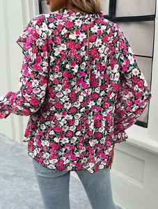 Detail of floral chiffon blouse featuring ruffled stand collar and back button closure
