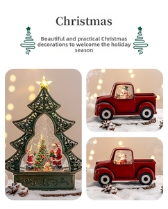 Detail of Christmas lantern with swirling glitter and Santa miniature inside a red truck