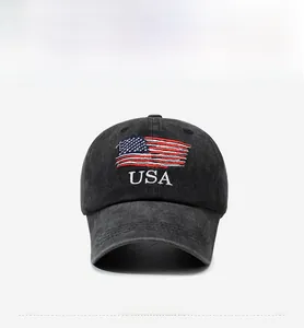 Close-up of USA embroidery and American flag on dark grey washed denim baseball cap