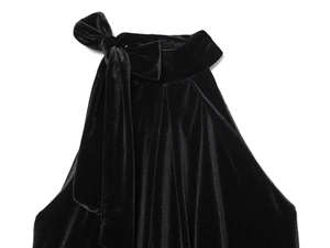 Detail of black velvet halter top featuring a delicate bow tie on the neckline