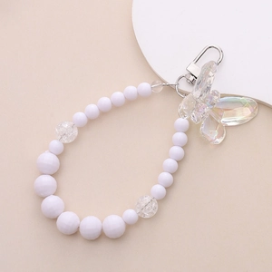 Beaded keychain with white pearls, faceted crystals, and transparent butterfly pendant