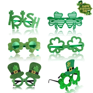 Set of six St. Patrick's Day themed glasses with green glitter and clover designs
