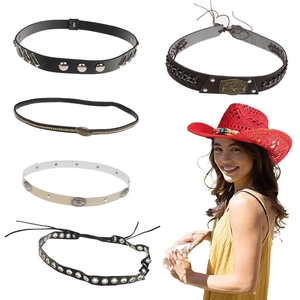 Detail view of woven leather belts and a red cowgirl hat with bohemian metal accessories
