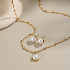 Elegant gold-plated stainless steel pearl necklace and earrings set for women