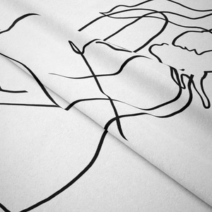 Close-up of soft microfiber fabric texture with minimalist black line art wall hanging