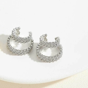 Detail of silver double-layered ear cuffs with wheat pattern and micro-pave zircons