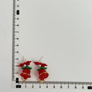 Detailed size measurement of handmade red beaded Christmas tree earrings with bow