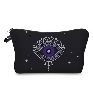 Detail of black cosmetic bag with evil eye and star print and smooth zipper closure
