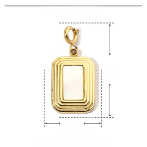 Macro view of gold stainless steel pendant with dimensions 12mm by 25mm on shell inlay