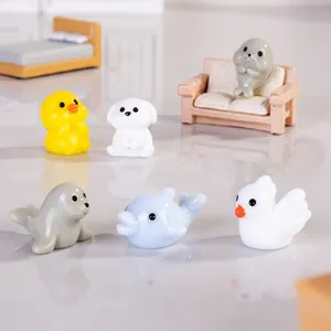 Glow-in-the-dark Capybara resin miniatures displayed on a tiny decorative sofa and bed