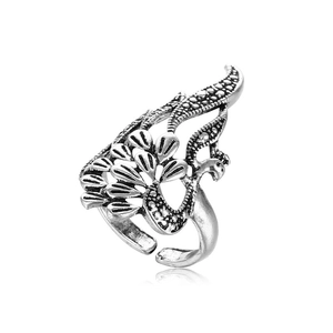 Detail view of vintage peacock hollow ring with antique silver finish and open band